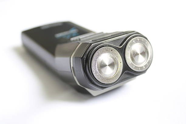 Modern black dual-head electric foil shaver on a clean white background.